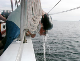 washing hair over the side of the schooner